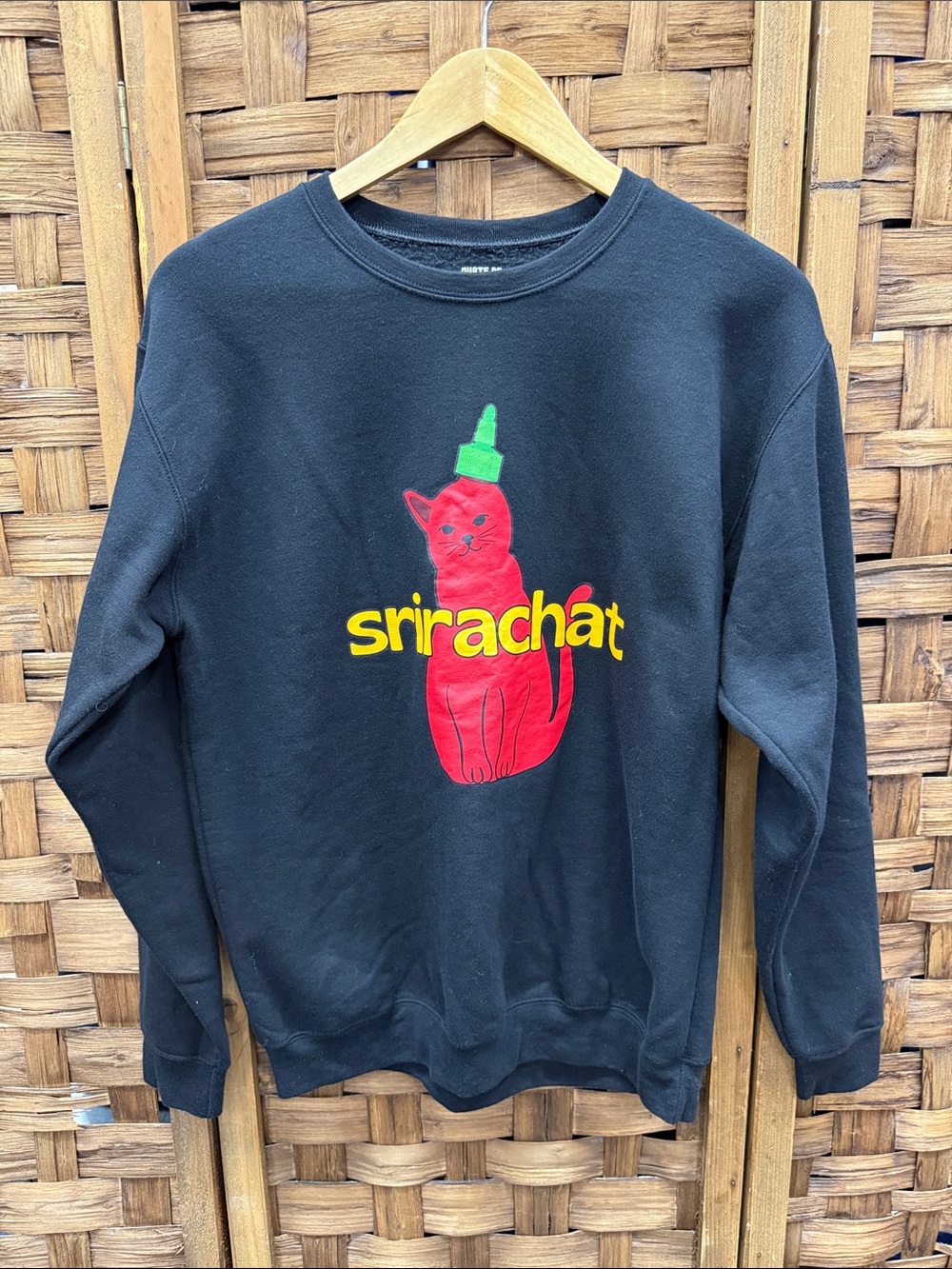 Black Crewneck Sweater with Red Cat Graphic and Yellow Text